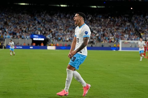 Maximiliano Araujo celebrates after scoring Uruguay's third goal